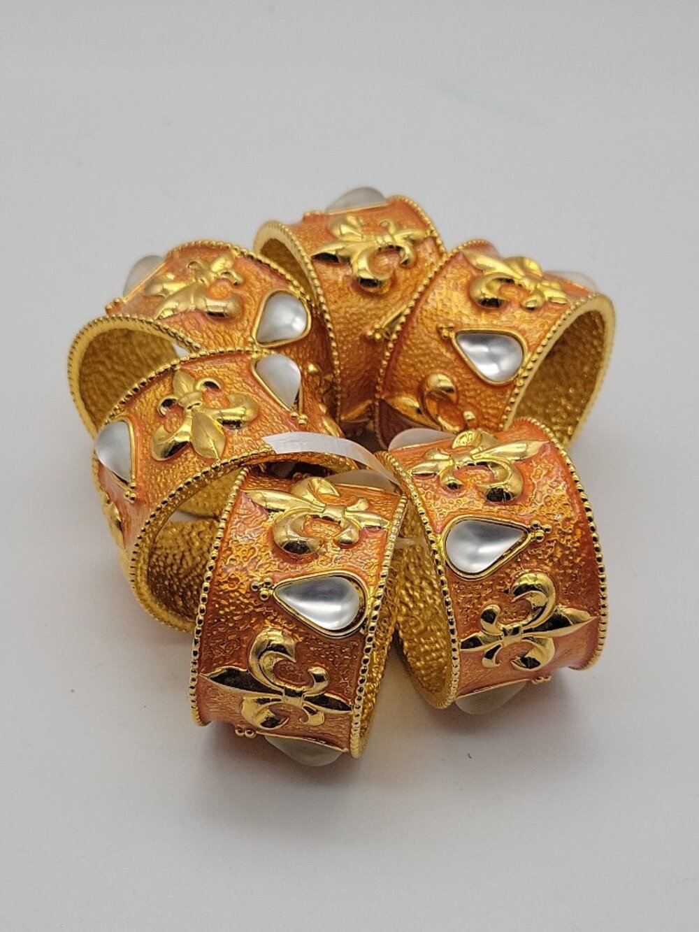 Set of 6 Gold Tone Fleur-de-Lis Textured Metal Napkin Rings Teardrop Inlay